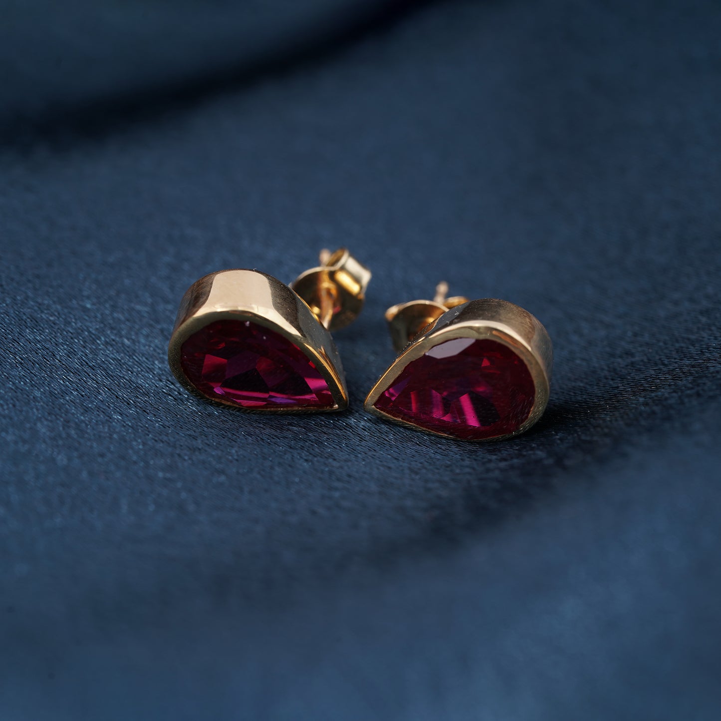 Golden Pear Shape Ruby Stud Earrings